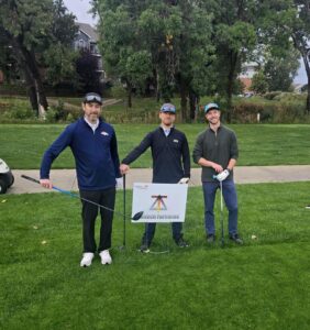 Picture of golfers with Deltech Furnaces sign